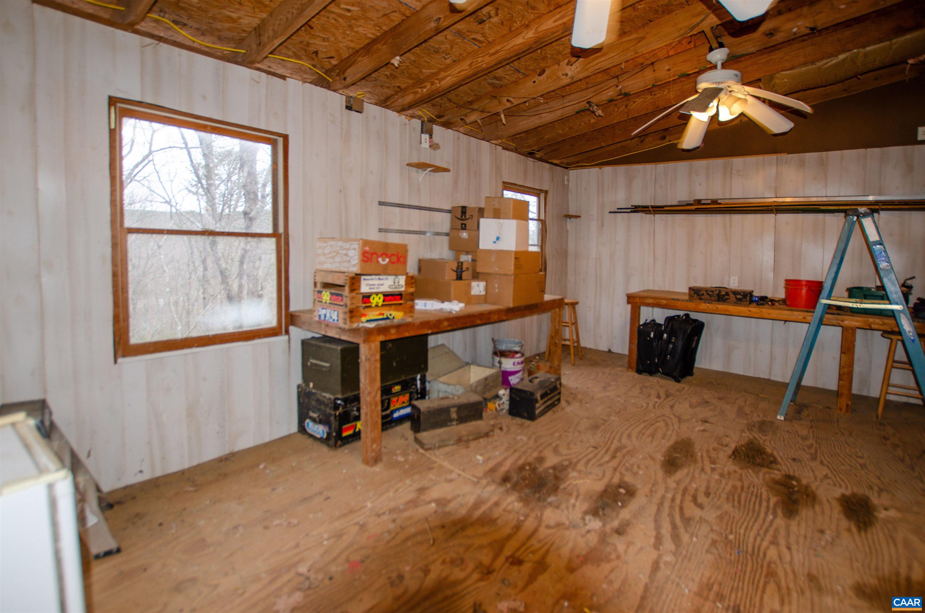 1709 Courthouse Road Palmyra, VA 22963 - Photo 54 of 59 a view of a workspace with furniture and a window
