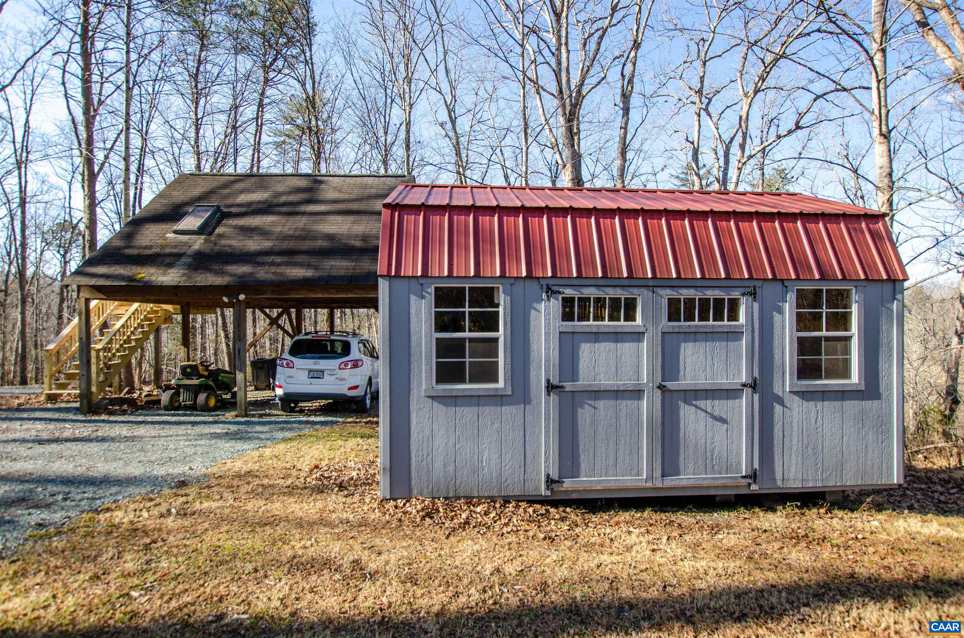 1709 Courthouse Road Palmyra, VA 22963 - Photo 57 of 59 a view of a house with a large tree and wooden fence