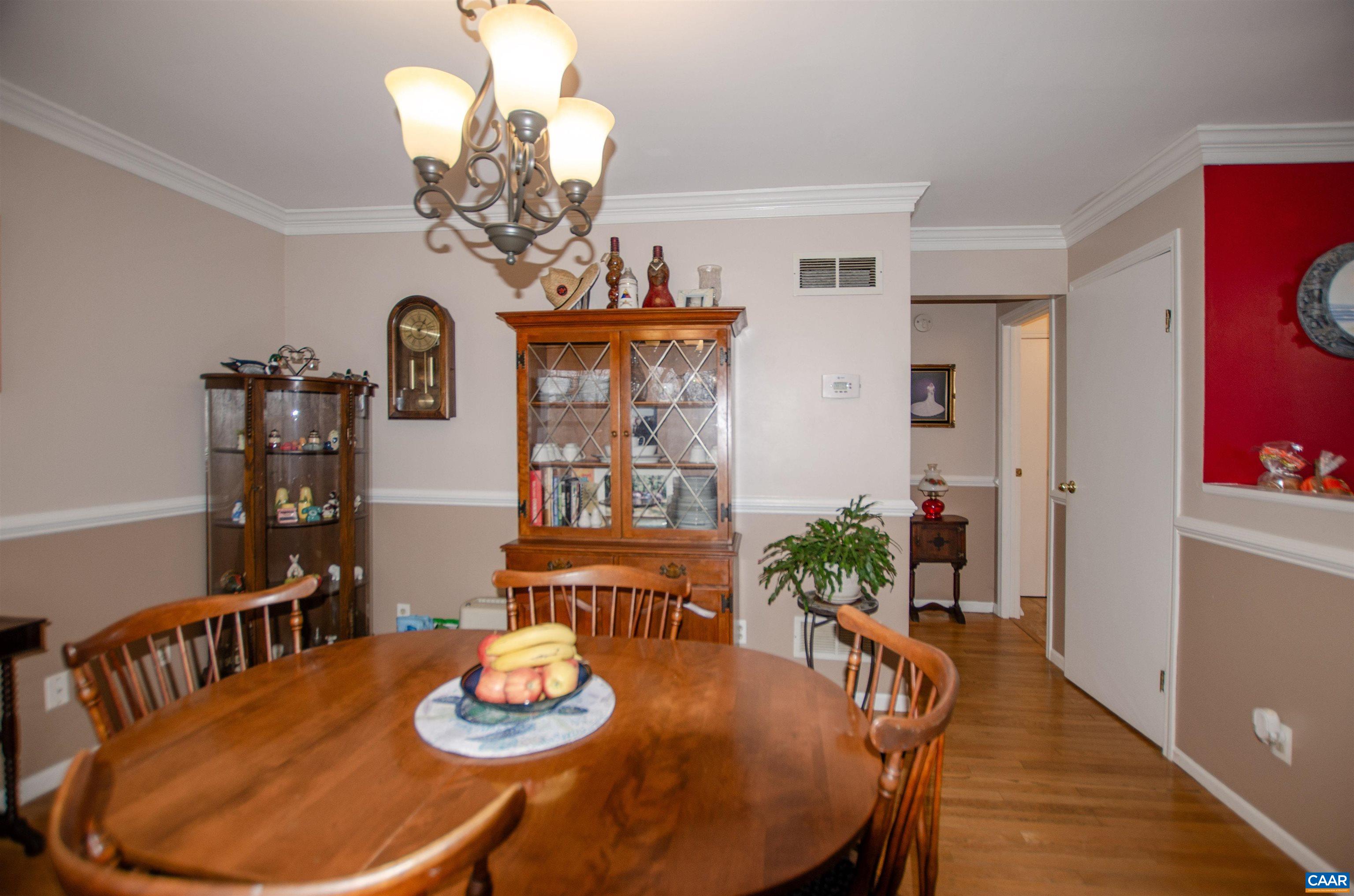 1709 Courthouse Road Palmyra, VA 22963 - Photo 8 of 59 a view of a dining room with furniture a chandelier and wooden floor