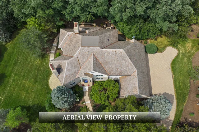 a living room with furniture and a dining table with wooden floor