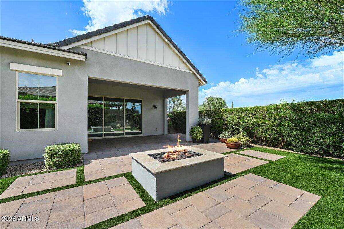 4412 East Roy Rogers Road Cave Creek, AZ 85331 - Photo 38 of 40 a view of a patio with couches table and chairs with garden