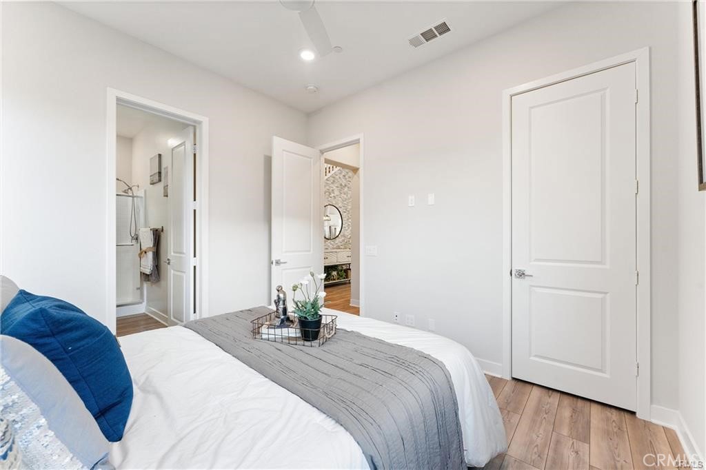 117 Denali Lake Forest, CA 92630 - Photo 11 of 40 a bedroom with a bed and wooden floor