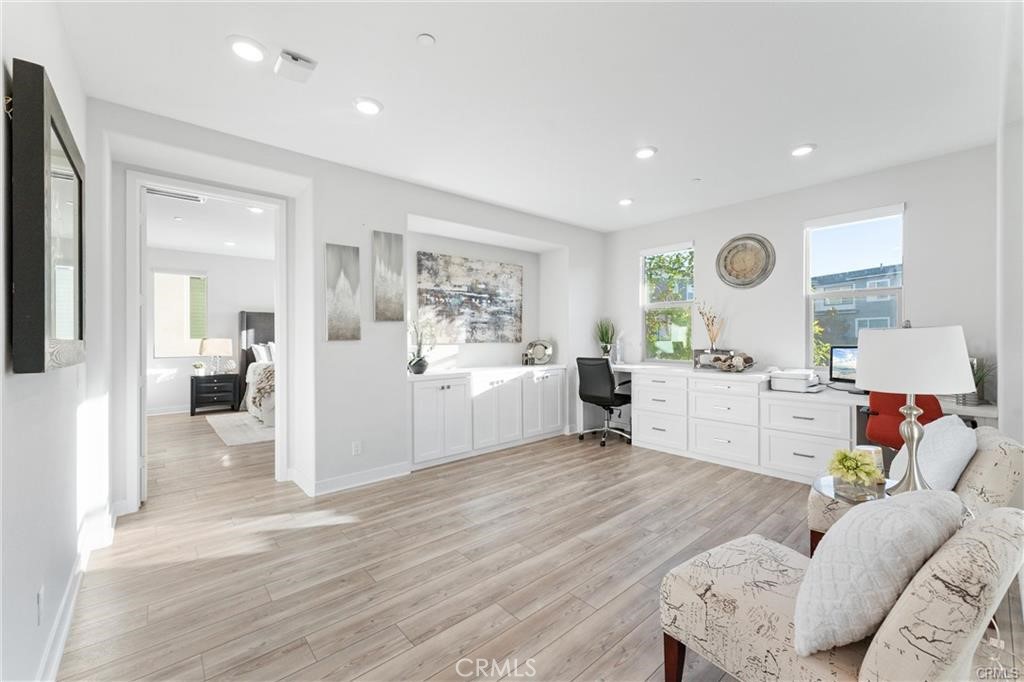 117 Denali Lake Forest, CA 92630 - Photo 14 of 40 a living room with furniture and a wooden floor