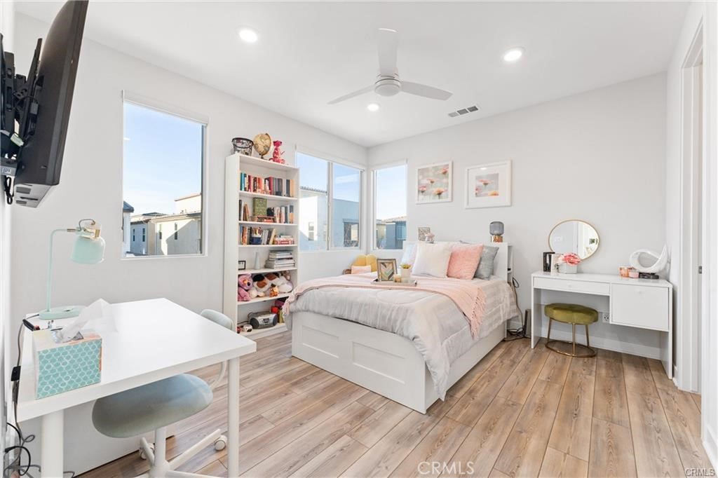 117 Denali Lake Forest, CA 92630 - Photo 19 of 40 a bedroom with a bed and a bookshelf