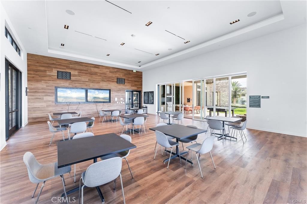 117 Denali Lake Forest, CA 92630 - Photo 39 of 40 a living room with patio furniture and a wooden floor