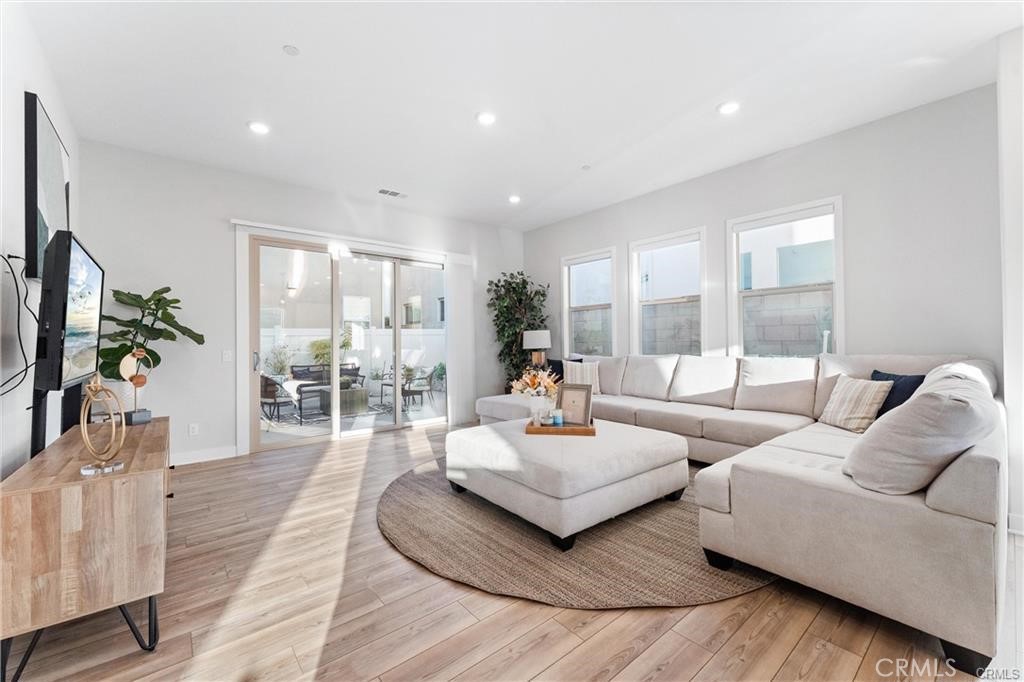 117 Denali Lake Forest, CA 92630 - Photo 6 of 40 a living room with fireplace furniture and a large window