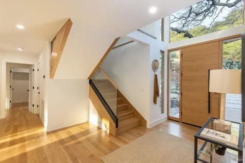 a spacious bedroom with a bed and a lamp