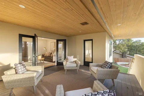 a view of city and trees from a balcony