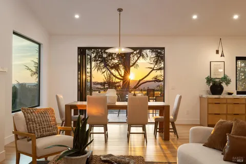 a kitchen with a sink a stove and a wooden floors