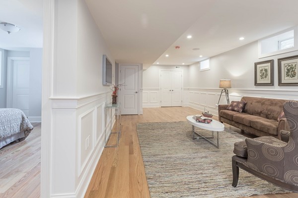 9 Bartlett Crescent, Unit 1 Brookline, MA 02446 - Photo 12 of 19 a living room with furniture and a couch