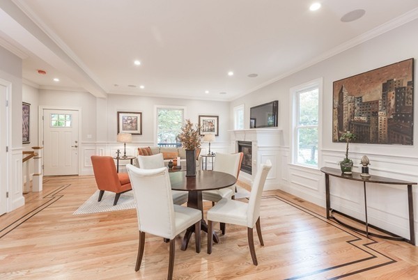 9 Bartlett Crescent, Unit 1 Brookline, MA 02446 - Photo 7 of 19 a view of a dining room with furniture window and wooden floor