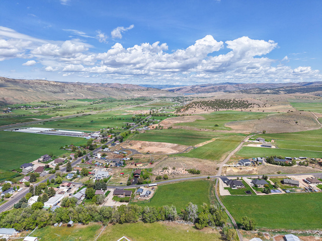 94 Spring Canyon Road Coalville, UT 84017 - Photo 26 of 50 Expansive rural setting featuring verdant fields and distant mountains