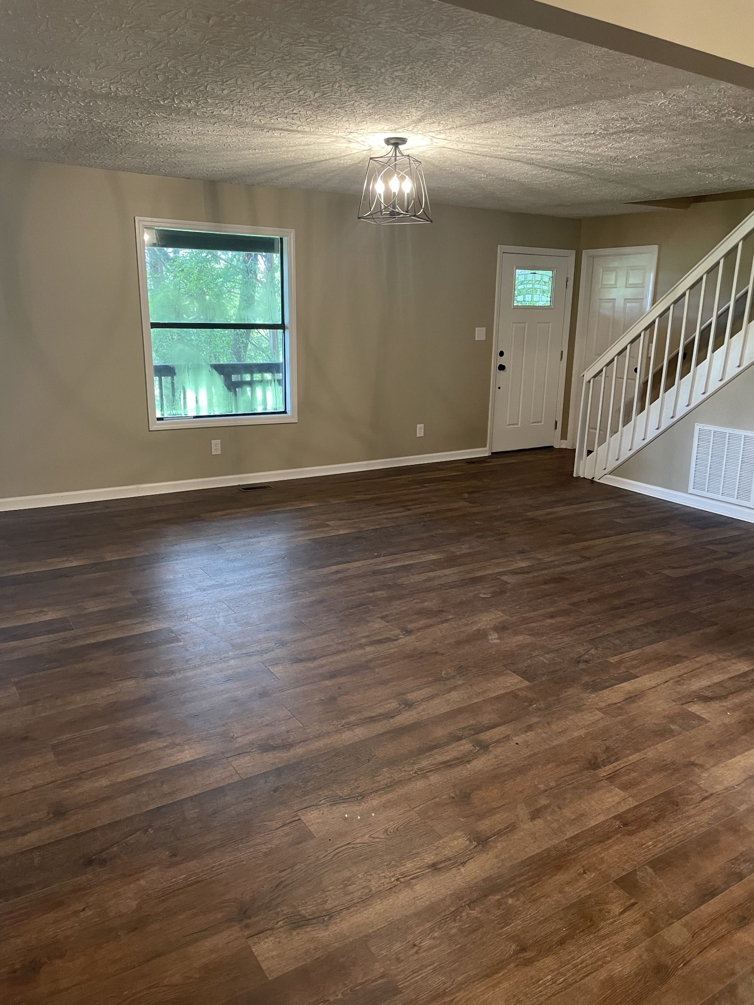 207 Chipman Road Bethpage, TN 37022 - Photo 18 of 31 Living Room with Laminate Flooring and Front Entrance