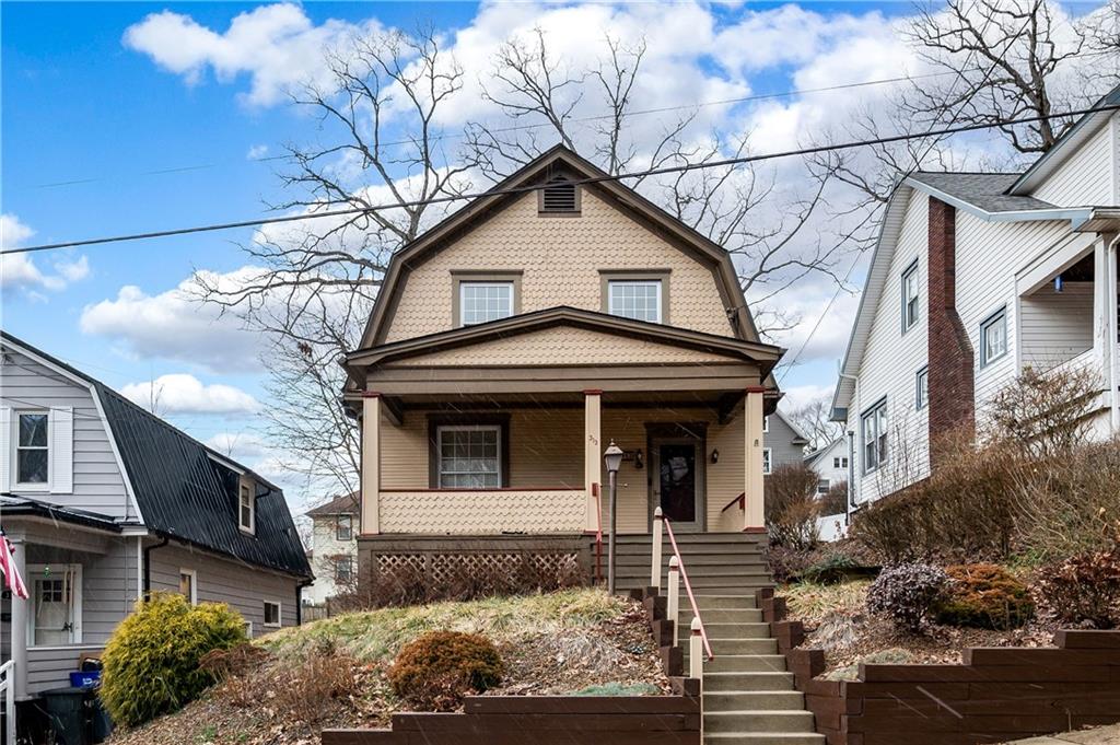 a front view of a house with garden
