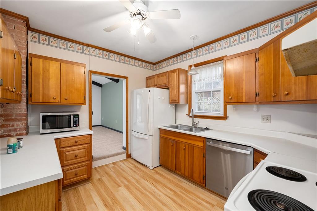 313 Oak Street Butler, PA 16001 - Photo 8 of 23 a kitchen with stainless steel appliances a stove a sink and a refrigerator