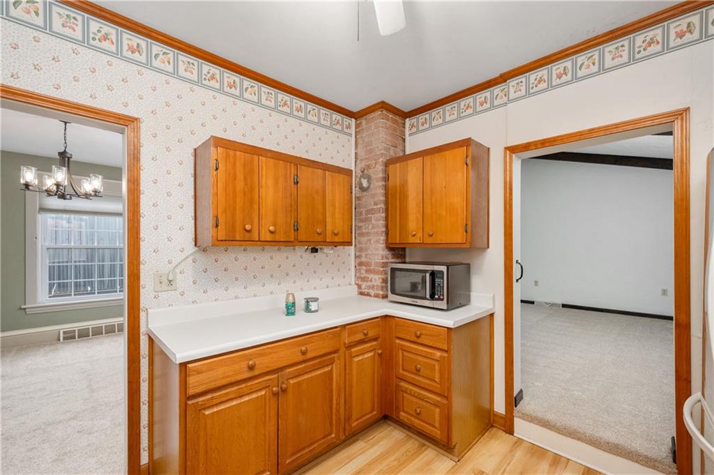 313 Oak Street Butler, PA 16001 - Photo 10 of 23 a kitchen with stainless steel appliances granite countertop a sink and cabinets