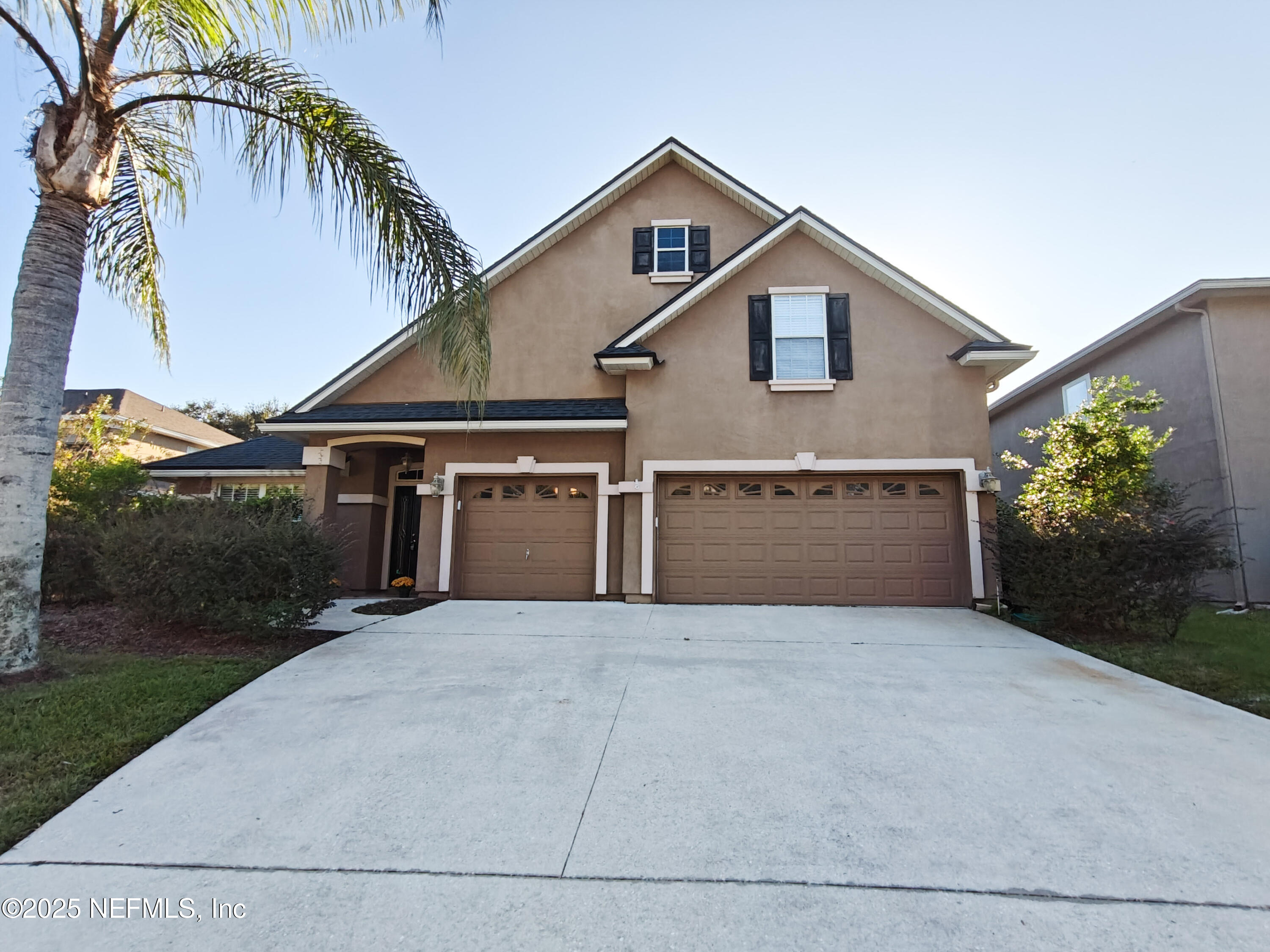 1505 Majestic View Lane Fleming Island, FL 32003 - Photo 1 of 49 a front view of a house with a yard and garage