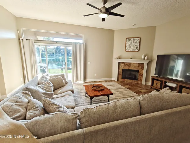 a backyard of a house with yard and outdoor seating