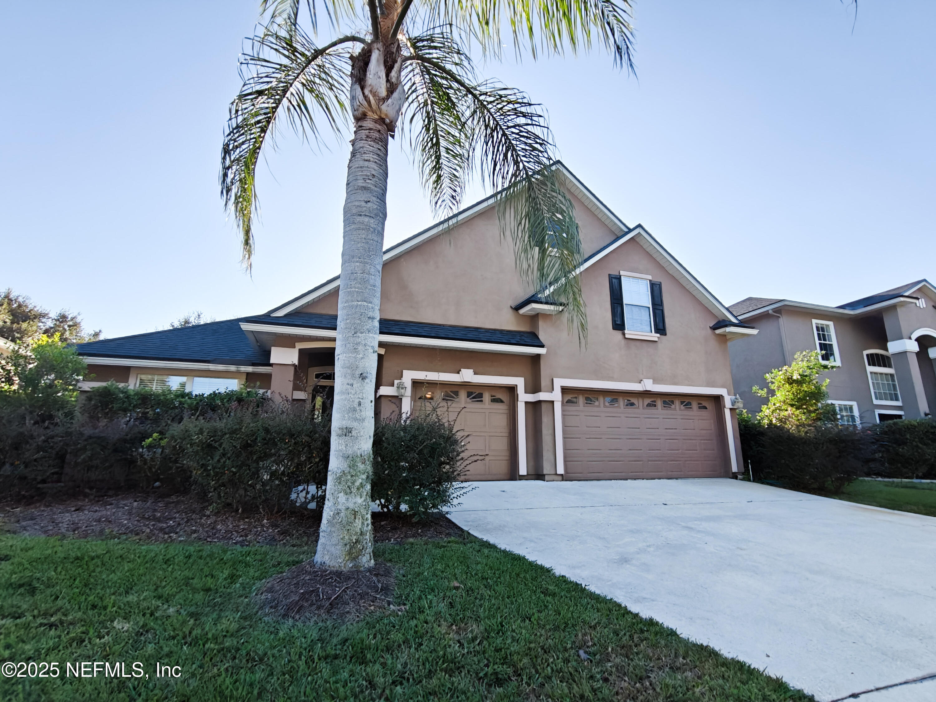 1505 Majestic View Lane Fleming Island, FL 32003 - Photo 2 of 49 a front view of a house with a yard and potted plants