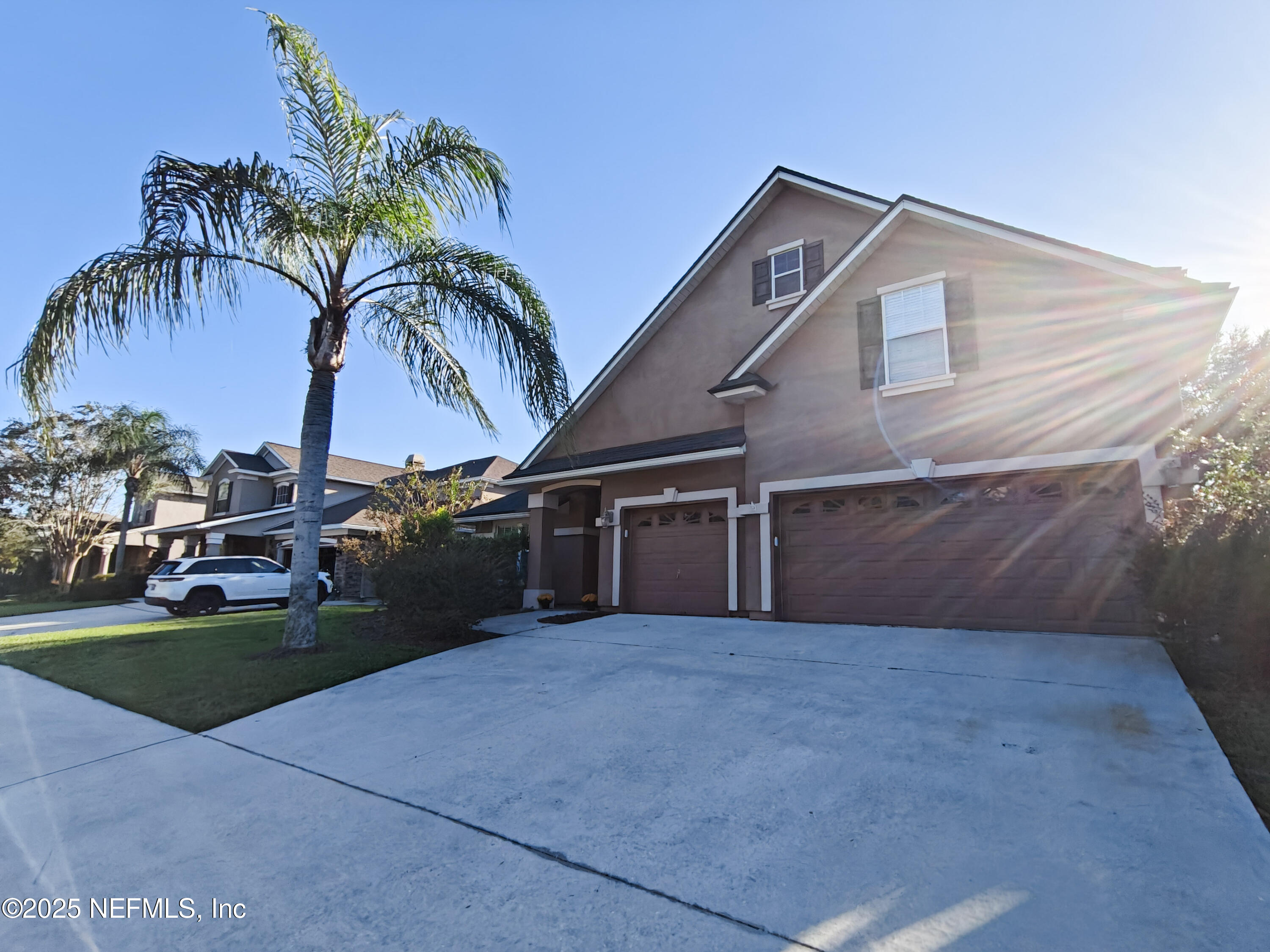 1505 Majestic View Lane Fleming Island, FL 32003 - Photo 3 of 49 a view of a house with a yard and potted plants