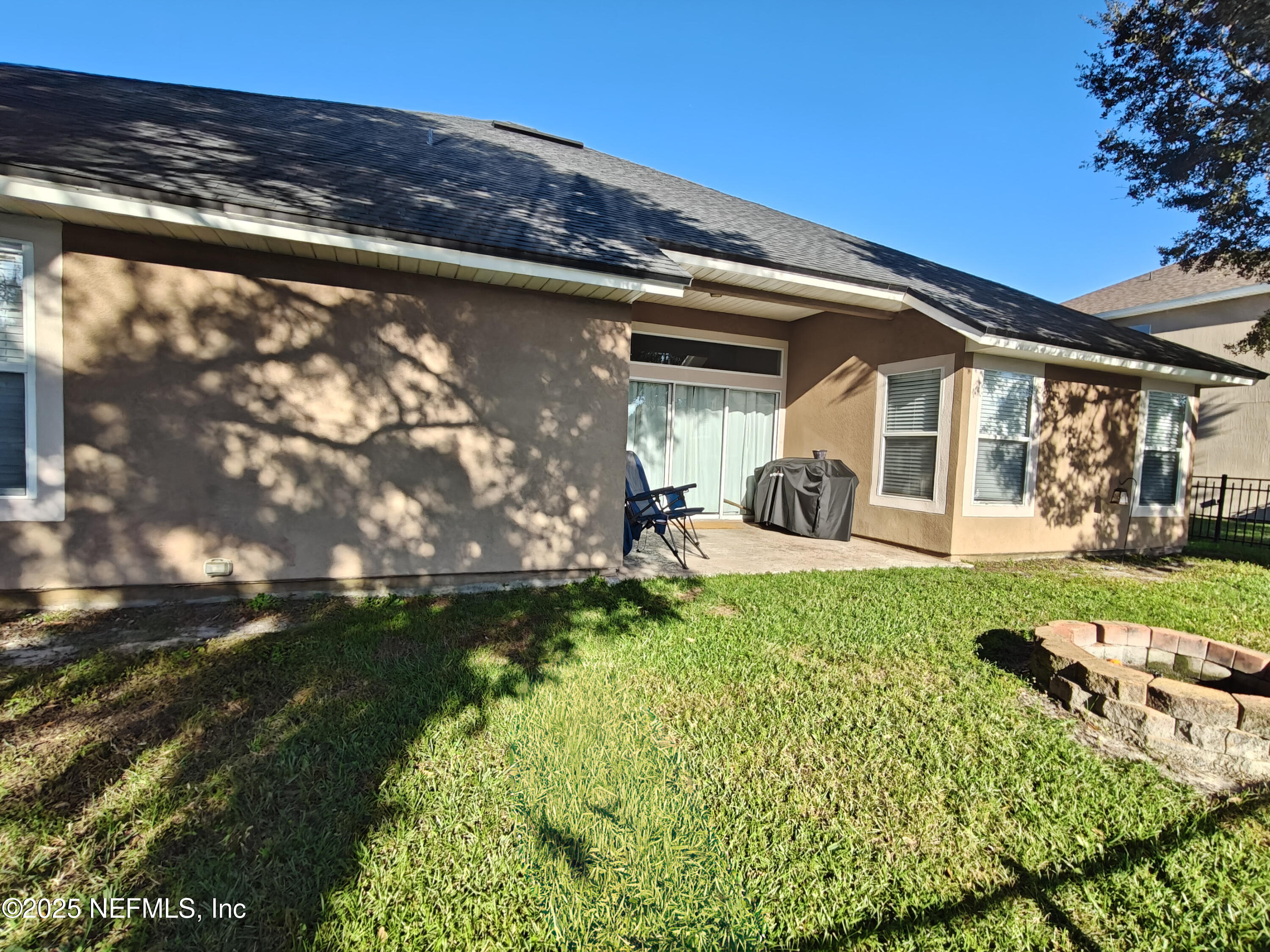 1505 Majestic View Lane Fleming Island, FL 32003 - Photo 42 of 49 a backyard of a house with yard and outdoor seating