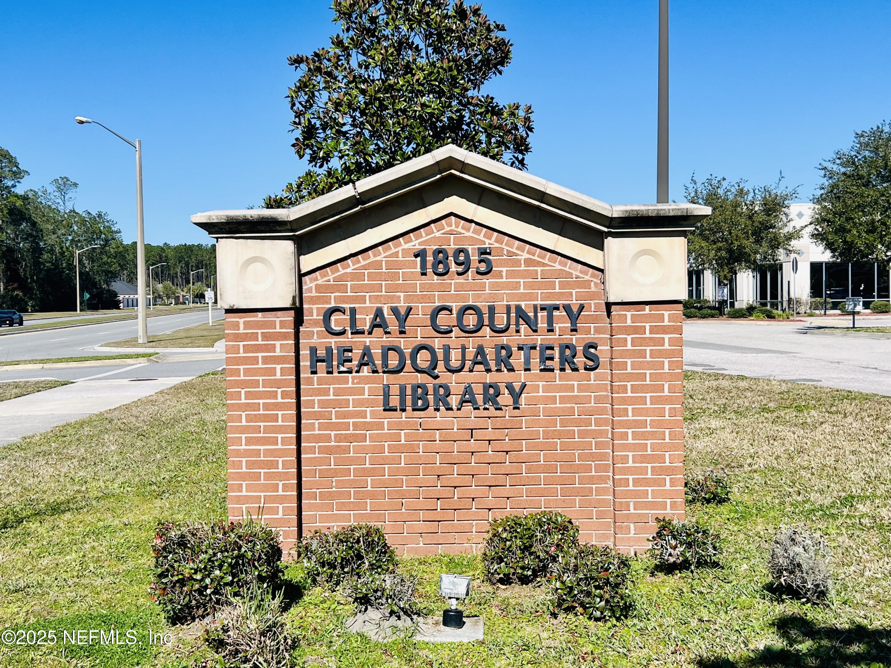 1505 Majestic View Lane Fleming Island, FL 32003 - Photo 48 of 49 a sign on the side of a building