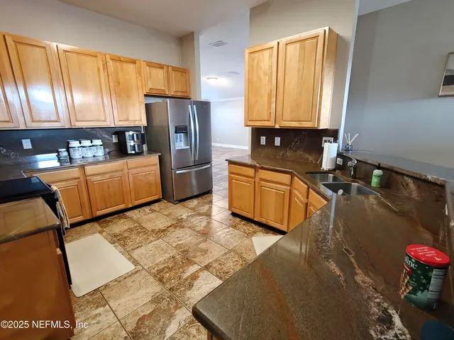 a bedroom with a bed and a ceiling fan