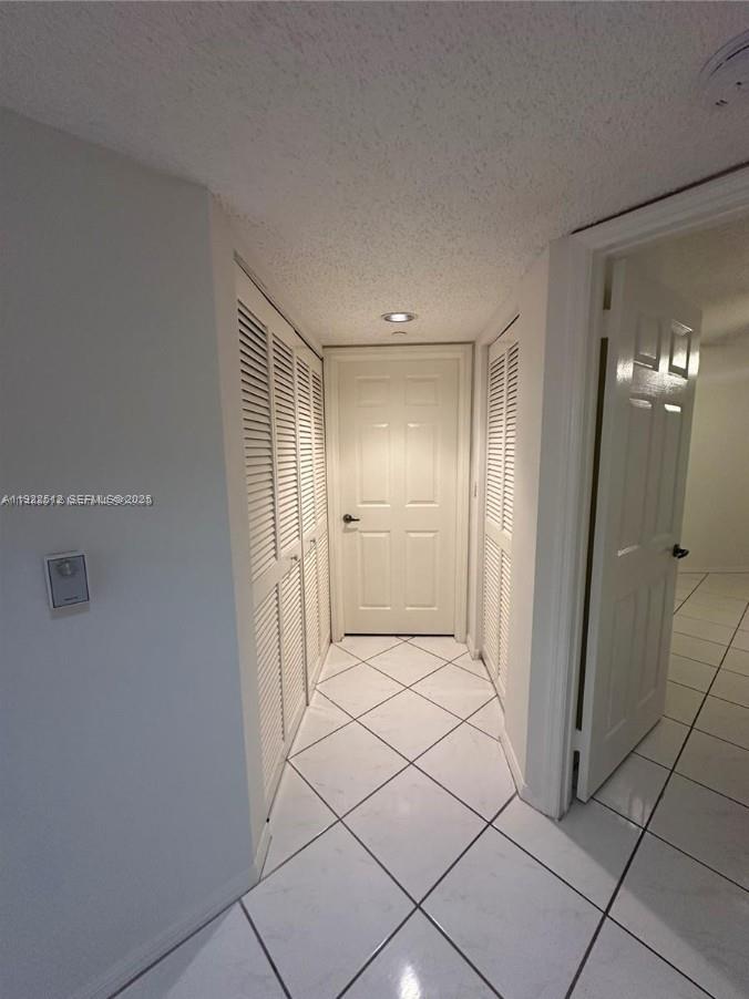 9587 Weldon Circle, Unit B203 Tamarac, FL 33321 - Photo 12 of 22 a bathroom with a shower and a glass door