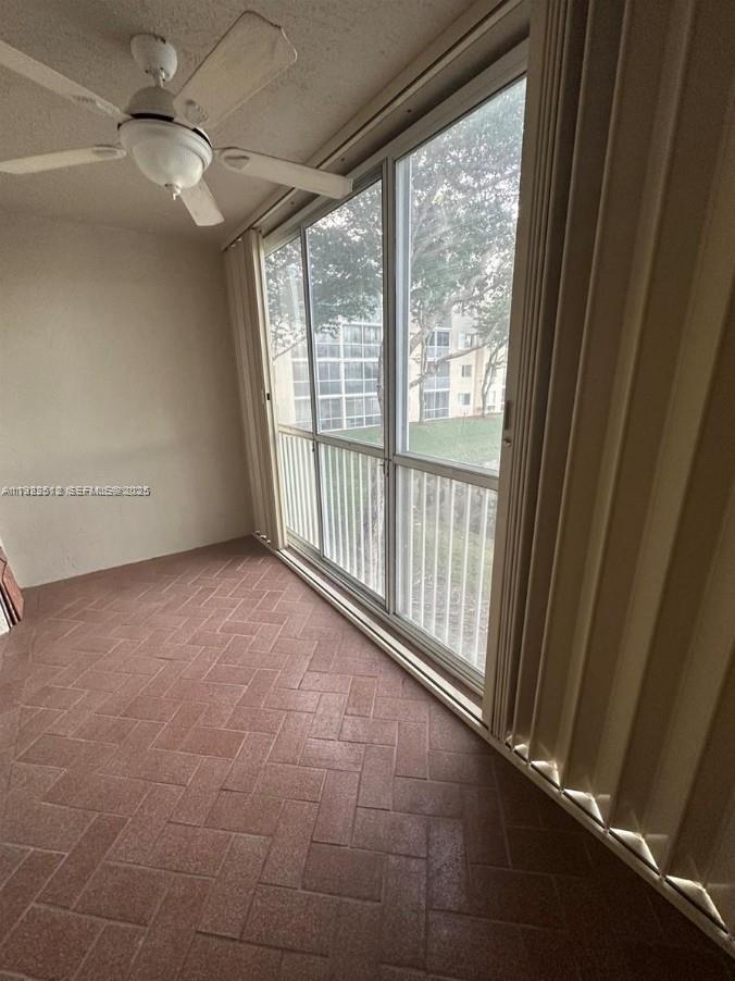 9587 Weldon Circle, Unit B203 Tamarac, FL 33321 - Photo 22 of 22 a view of an empty room with a window