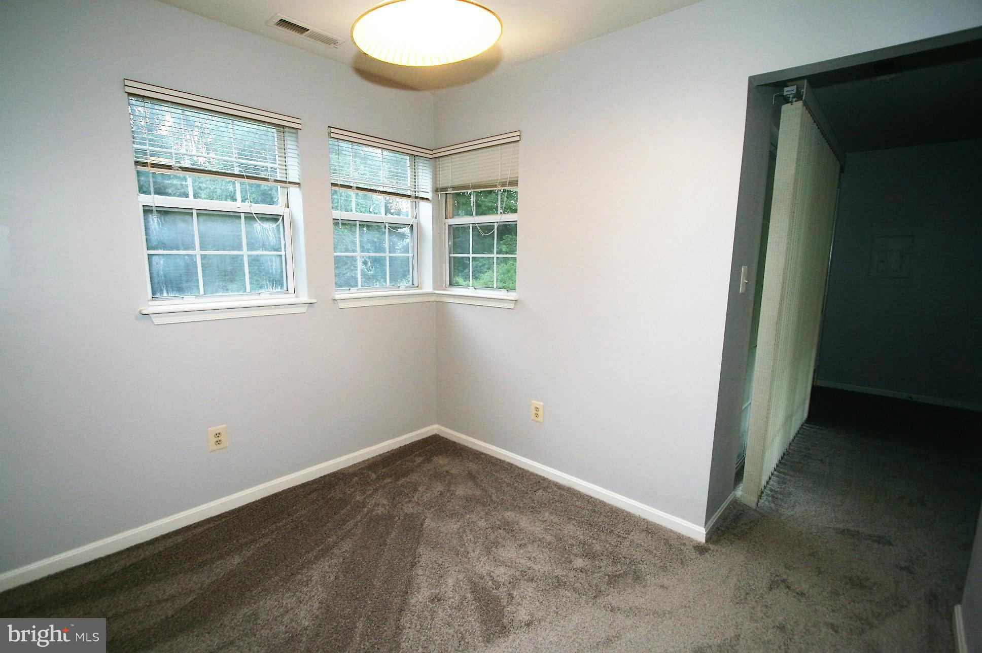 8583 Falls Run Road, Unit C Ellicott City, MD 21043 - Photo 7 of 21 Dining Room with view to back trees