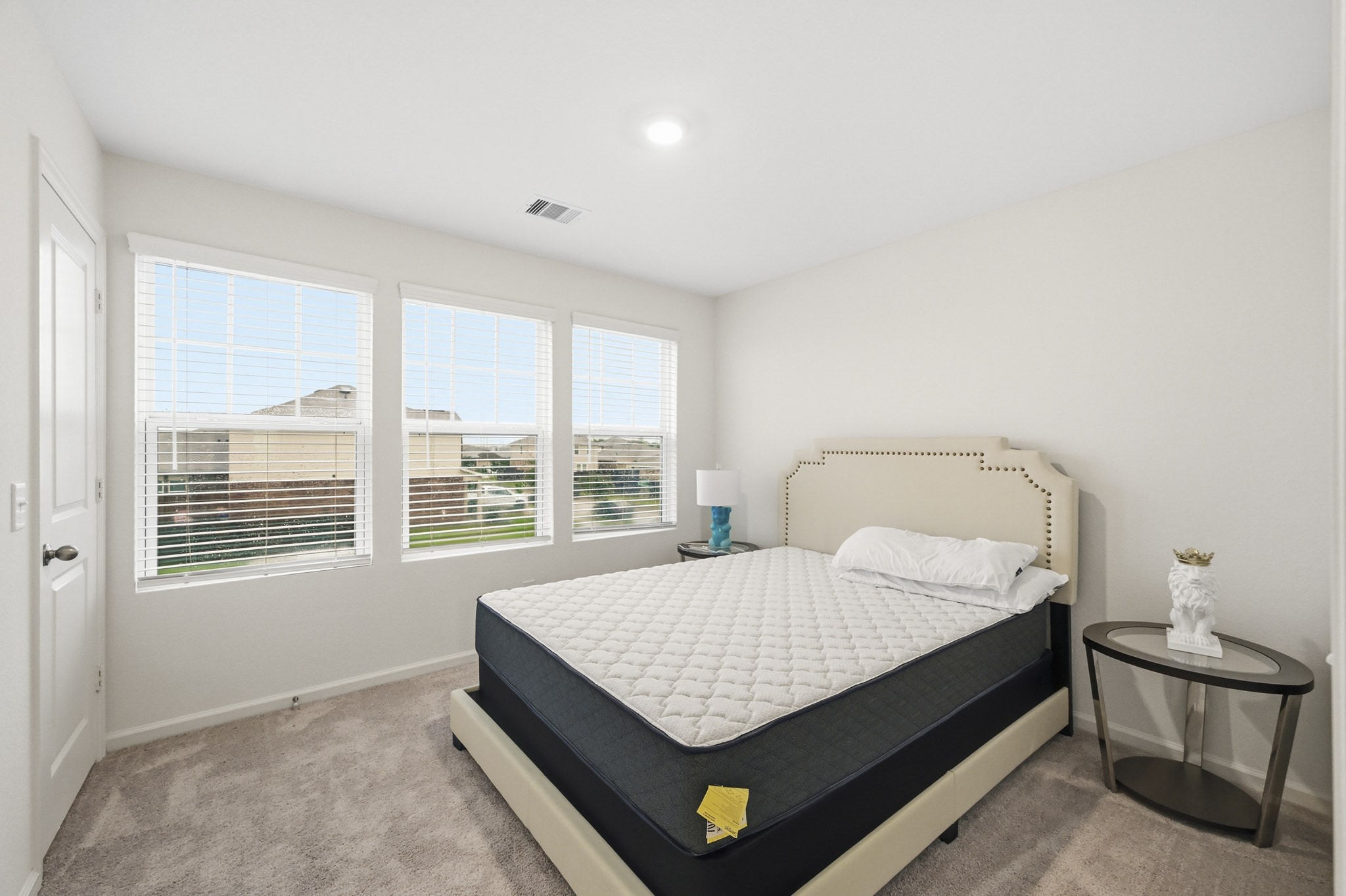 7207 Evitale Way Houston, TX 77049 - Photo 24 of 43 a bedroom with a bed a window and lamps
