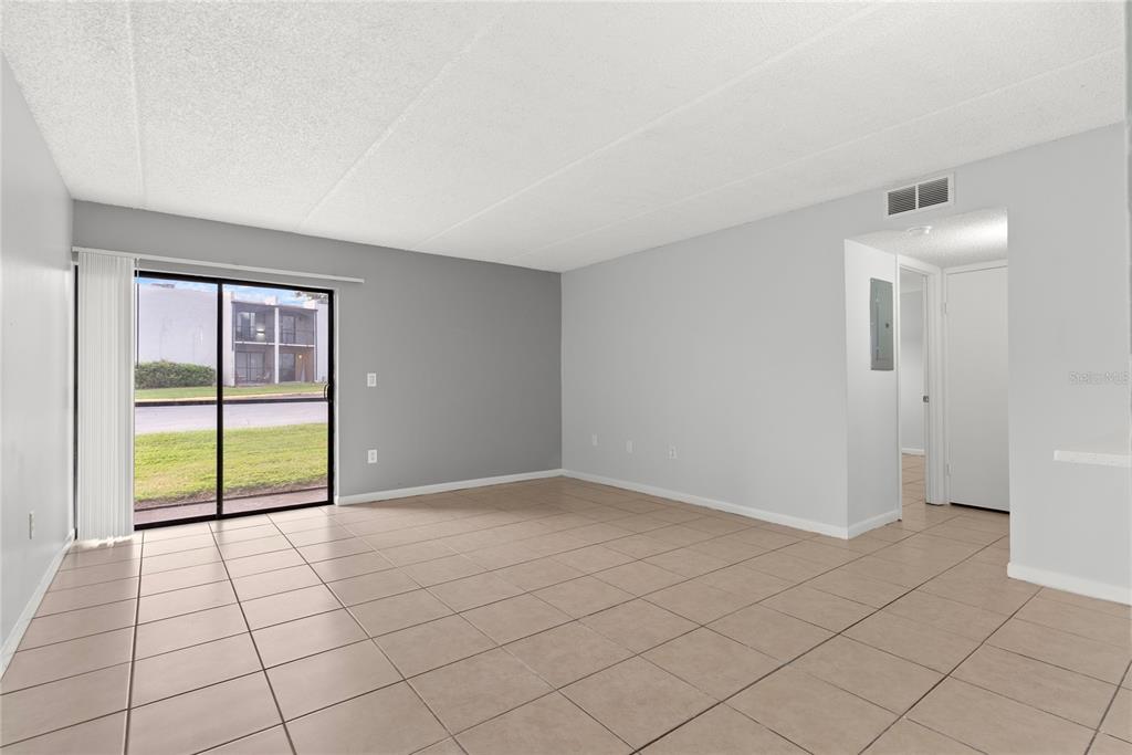 1108 Bartow Road, Unit 100 Lakeland, FL 33801 - Photo 8 of 15 a view of an empty room and window