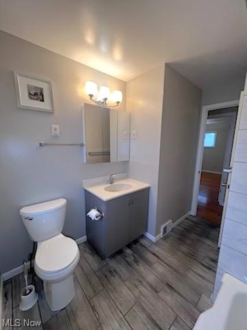 11701 Fordham Road Garfield Heights, OH 44125 - Photo 12 of 19 bathroom was updated with newer toilet, modern vanity, lighting and tri-view mirror.