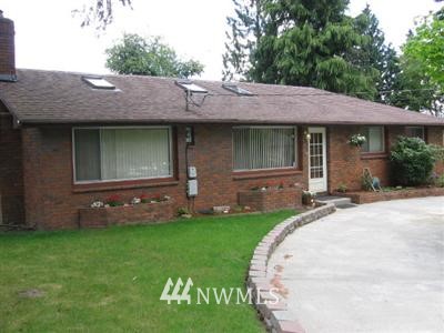 23505 2nd Avenue West Bothell, WA 98021 - Photo 1 of 1 a front view of a house with a garden