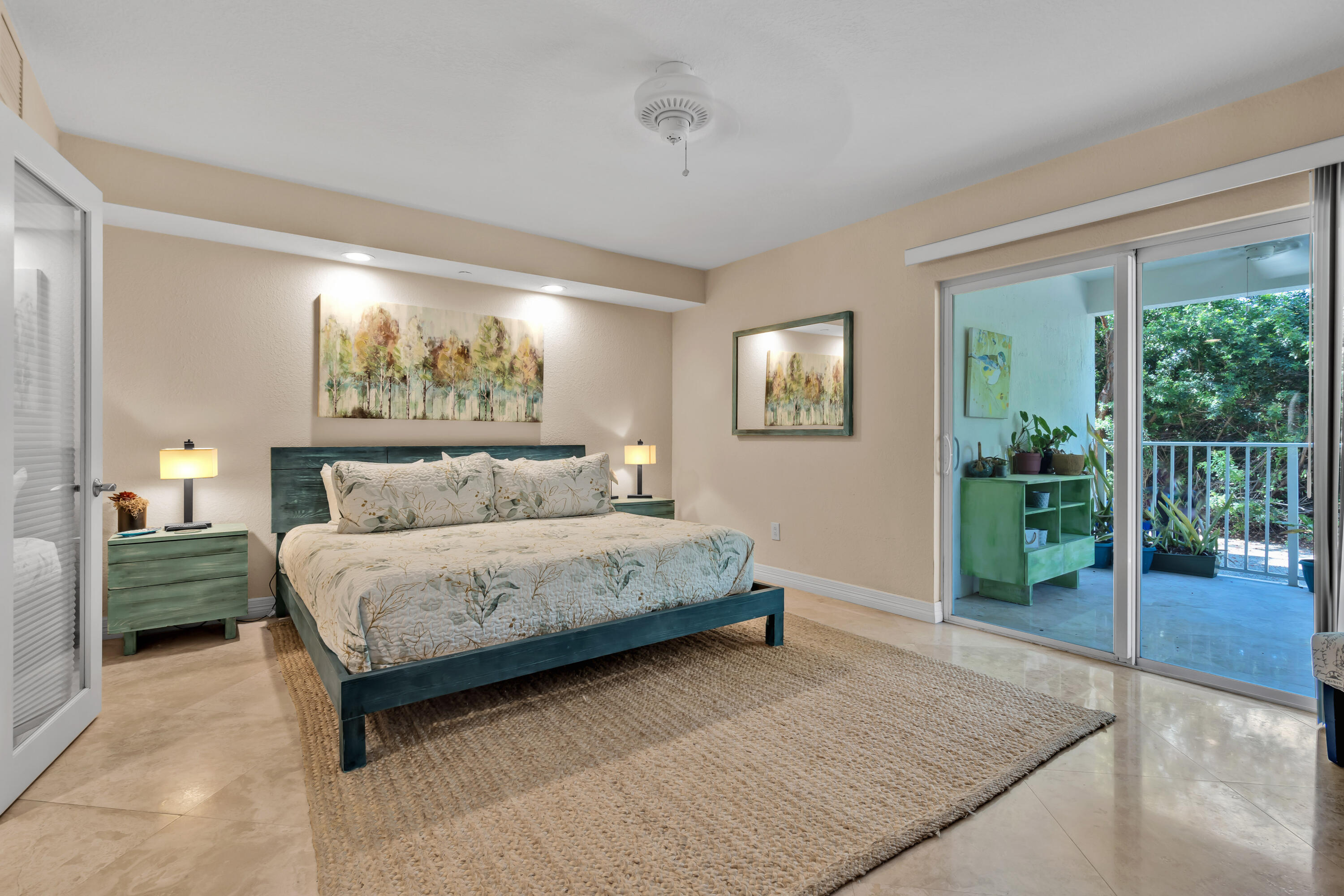 97501 Overseas Highway, Unit 607 Key Largo, FL 33037 - Photo 21 of 73 a spacious bedroom with a bed and glass walk in closet