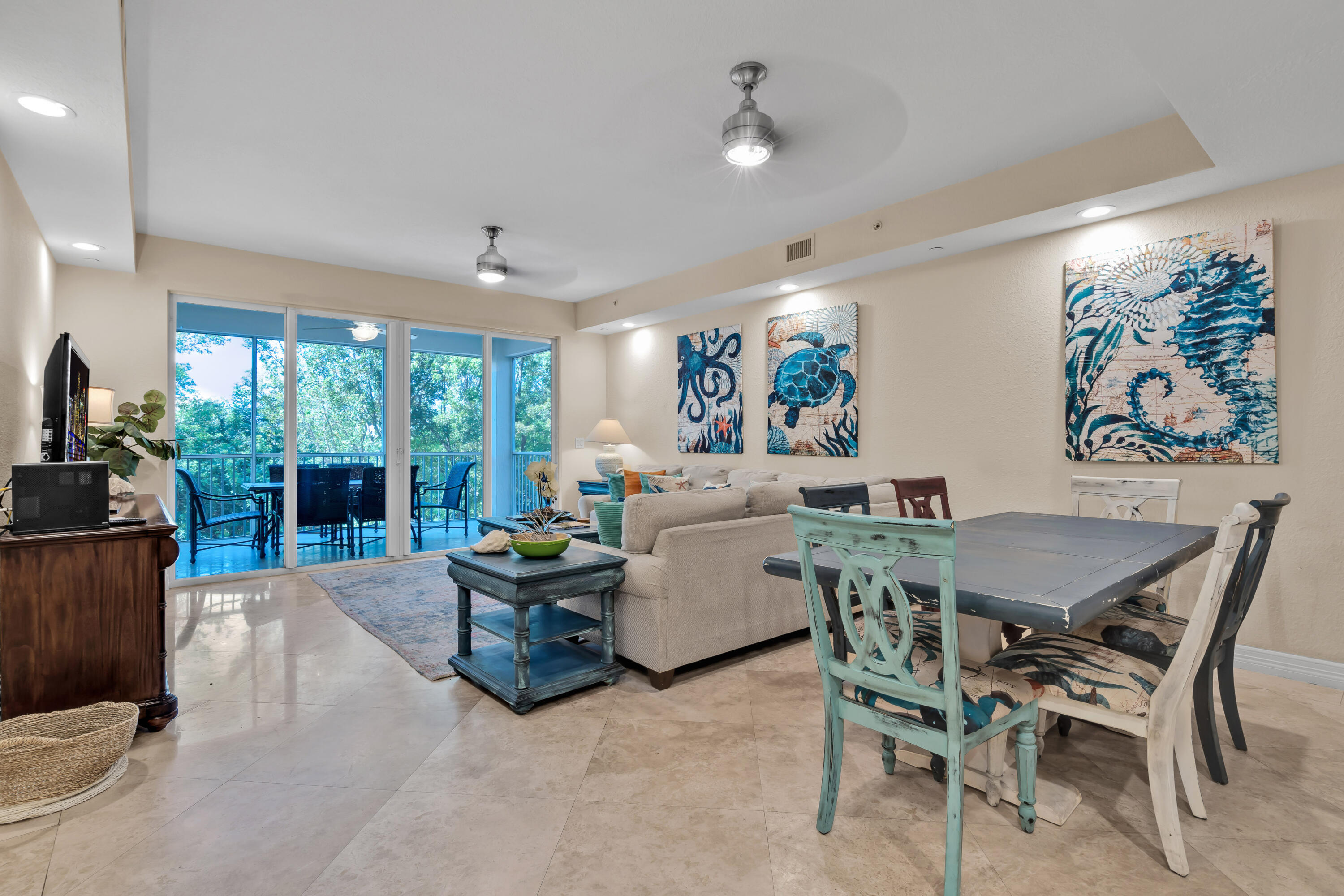97501 Overseas Highway, Unit 607 Key Largo, FL 33037 - Photo 27 of 73 a living room with furniture and a large window
