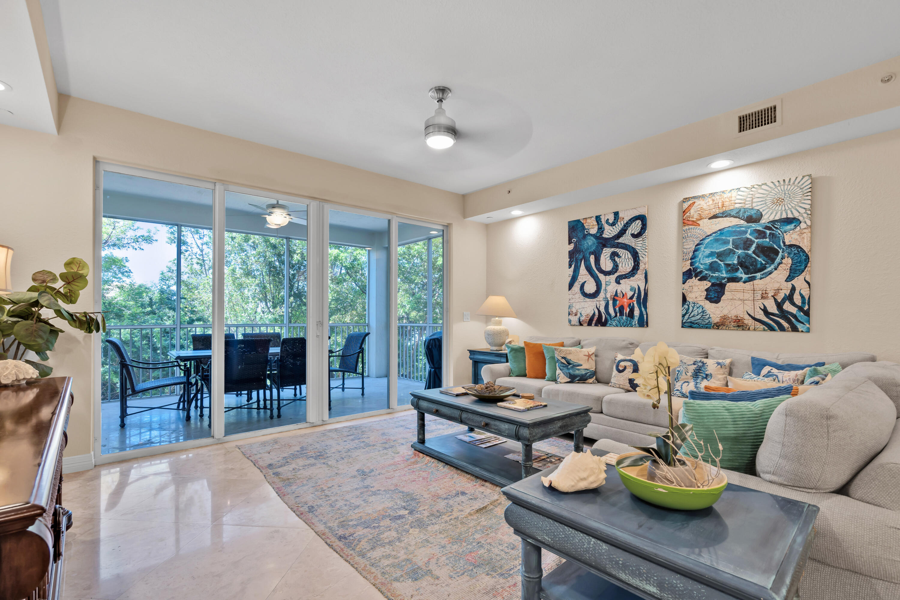 97501 Overseas Highway, Unit 607 Key Largo, FL 33037 - Photo 28 of 73 a living room with furniture and a large window
