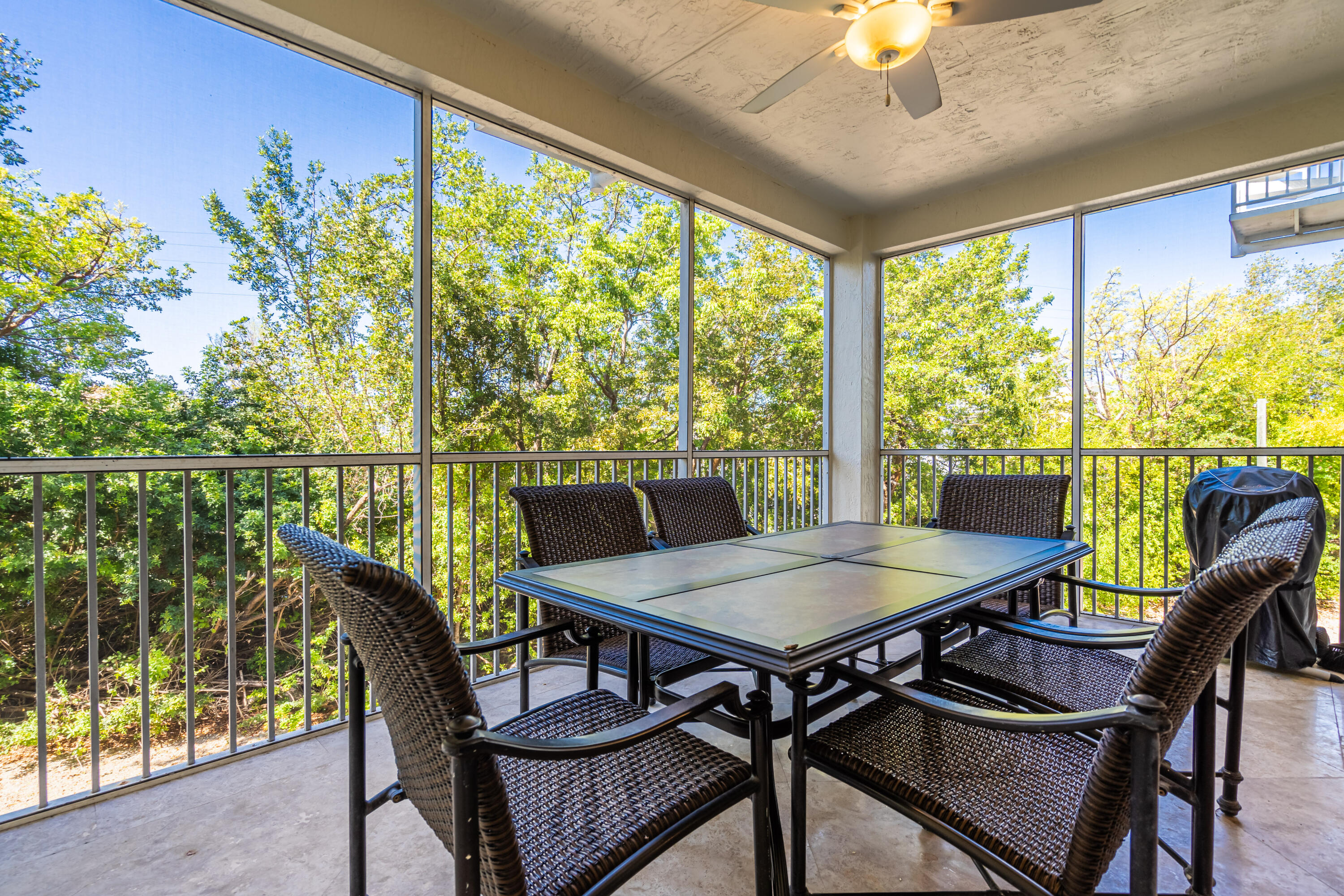 97501 Overseas Highway, Unit 607 Key Largo, FL 33037 - Photo 29 of 73 a view of a dining room with furniture window and outside view