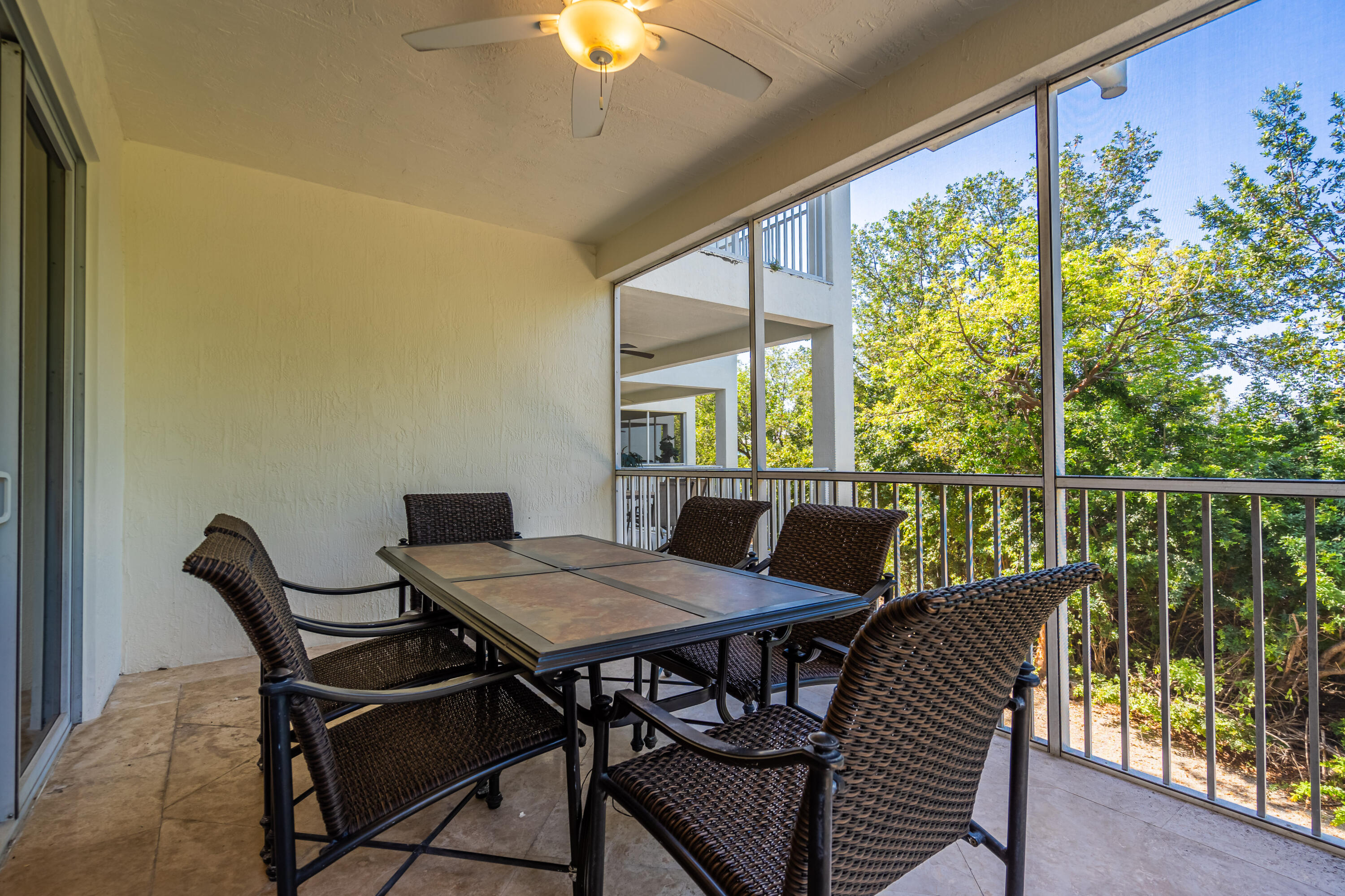 97501 Overseas Highway, Unit 607 Key Largo, FL 33037 - Photo 30 of 73 a view of a dining room with furniture window and outside view