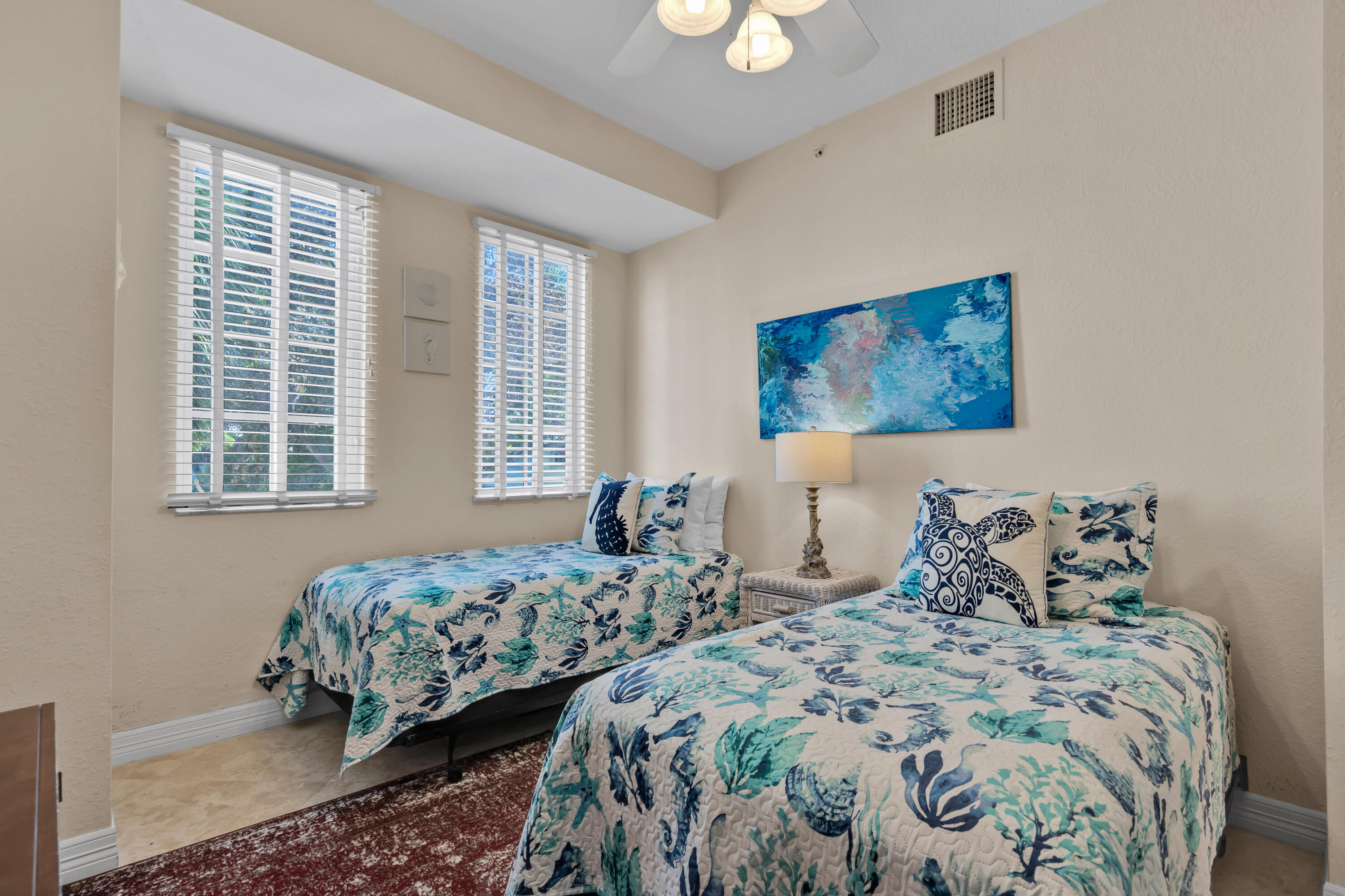 97501 Overseas Highway, Unit 607 Key Largo, FL 33037 - Photo 36 of 73 a bedroom with two beds and a large window