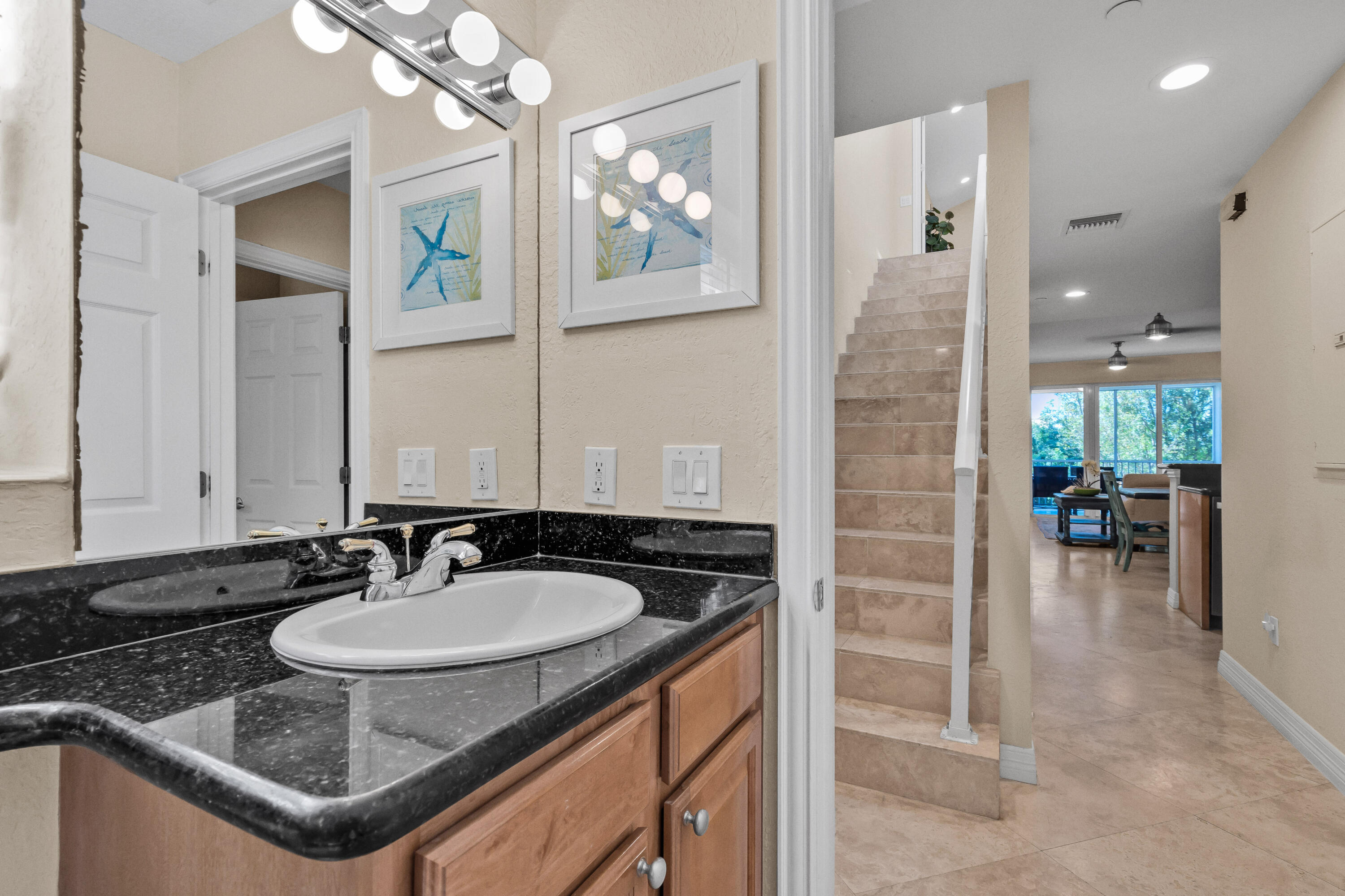 97501 Overseas Highway, Unit 607 Key Largo, FL 33037 - Photo 38 of 73 a bathroom with a sink and a mirror