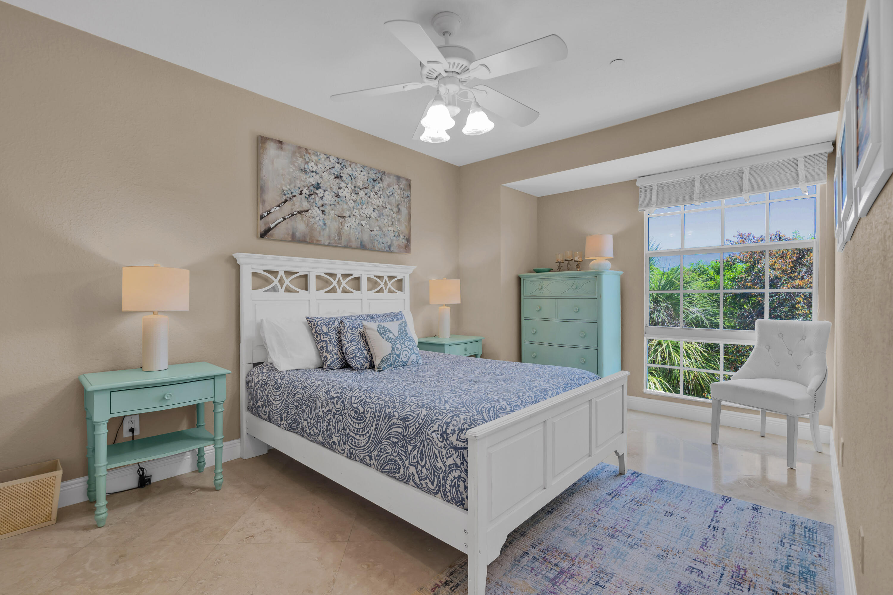 97501 Overseas Highway, Unit 607 Key Largo, FL 33037 - Photo 40 of 73 a bedroom with a large bed a table and chair