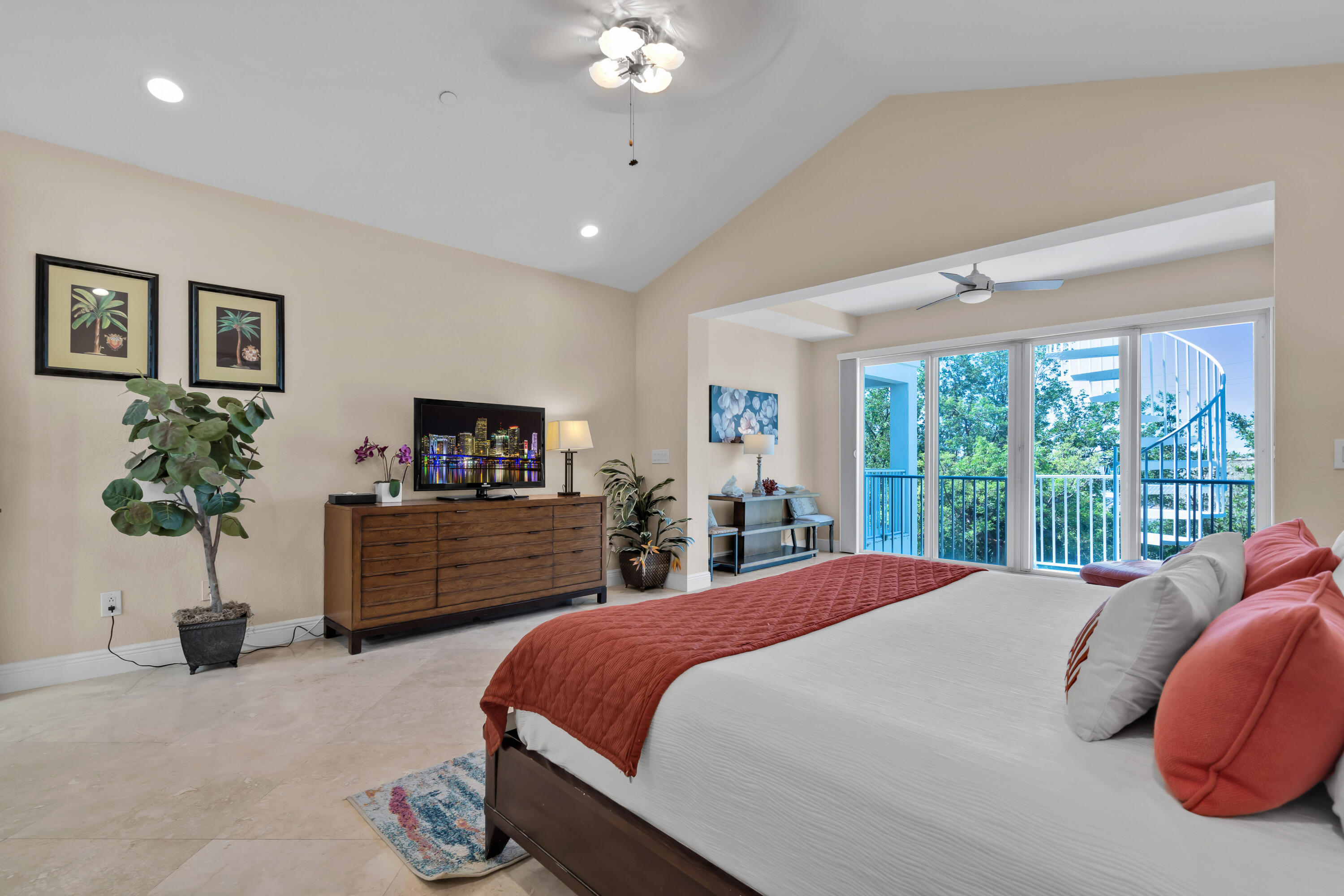 97501 Overseas Highway, Unit 607 Key Largo, FL 33037 - Photo 44 of 73 a bedroom with a large bed and a chandelier