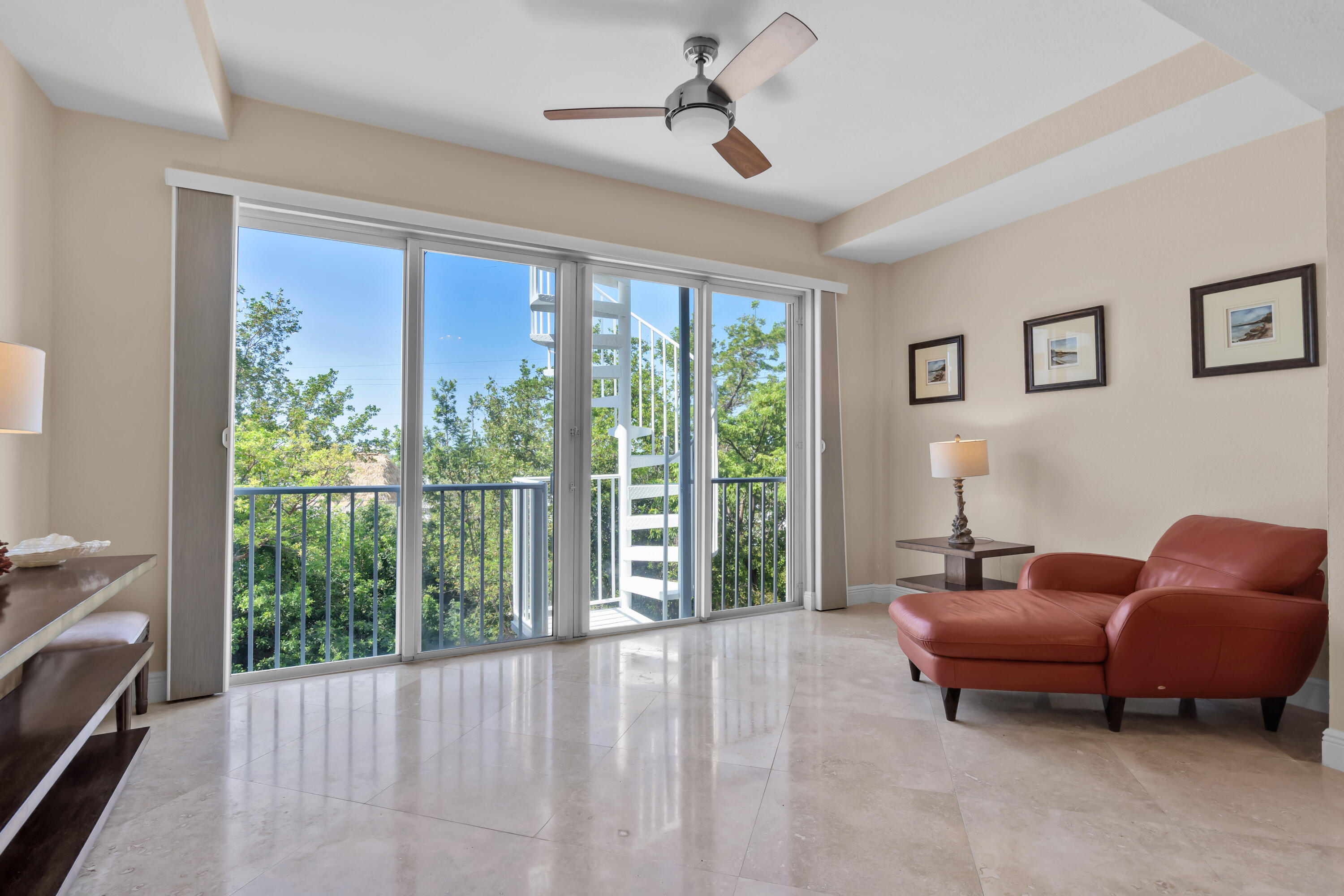 97501 Overseas Highway, Unit 607 Key Largo, FL 33037 - Photo 45 of 73 a bedroom with furniture and a large window