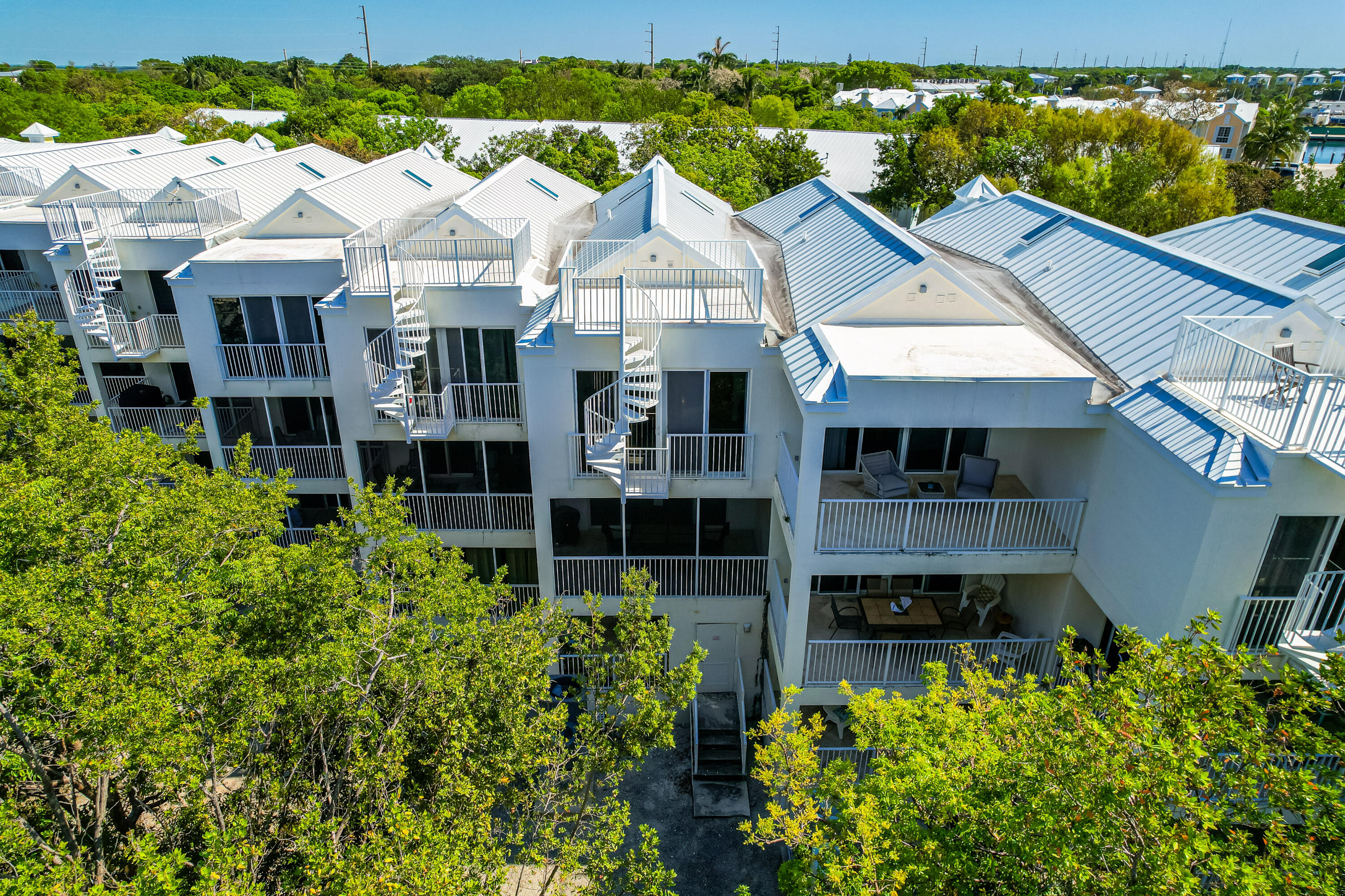 97501 Overseas Highway, Unit 607 Key Largo, FL 33037 - Photo 48 of 73 front view of a house with a yard