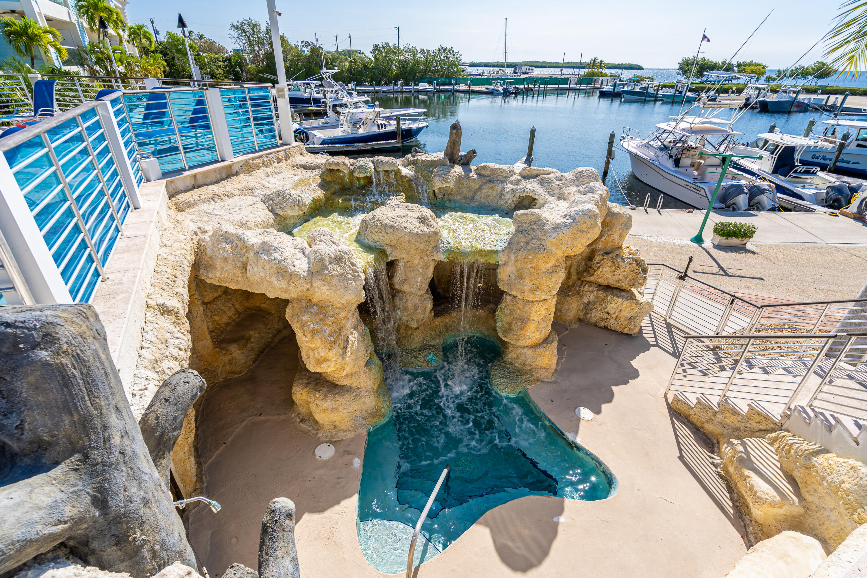 97501 Overseas Highway, Unit 607 Key Largo, FL 33037 - Photo 63 of 73 a terrace with outdoor seating and water view