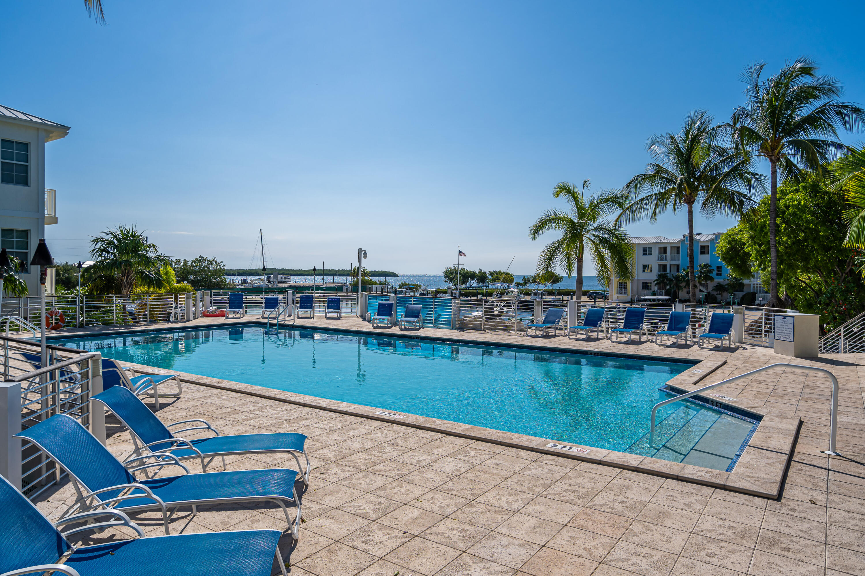 97501 Overseas Highway, Unit 607 Key Largo, FL 33037 - Photo 64 of 73 a view of swimming pool with outdoor seating and plants