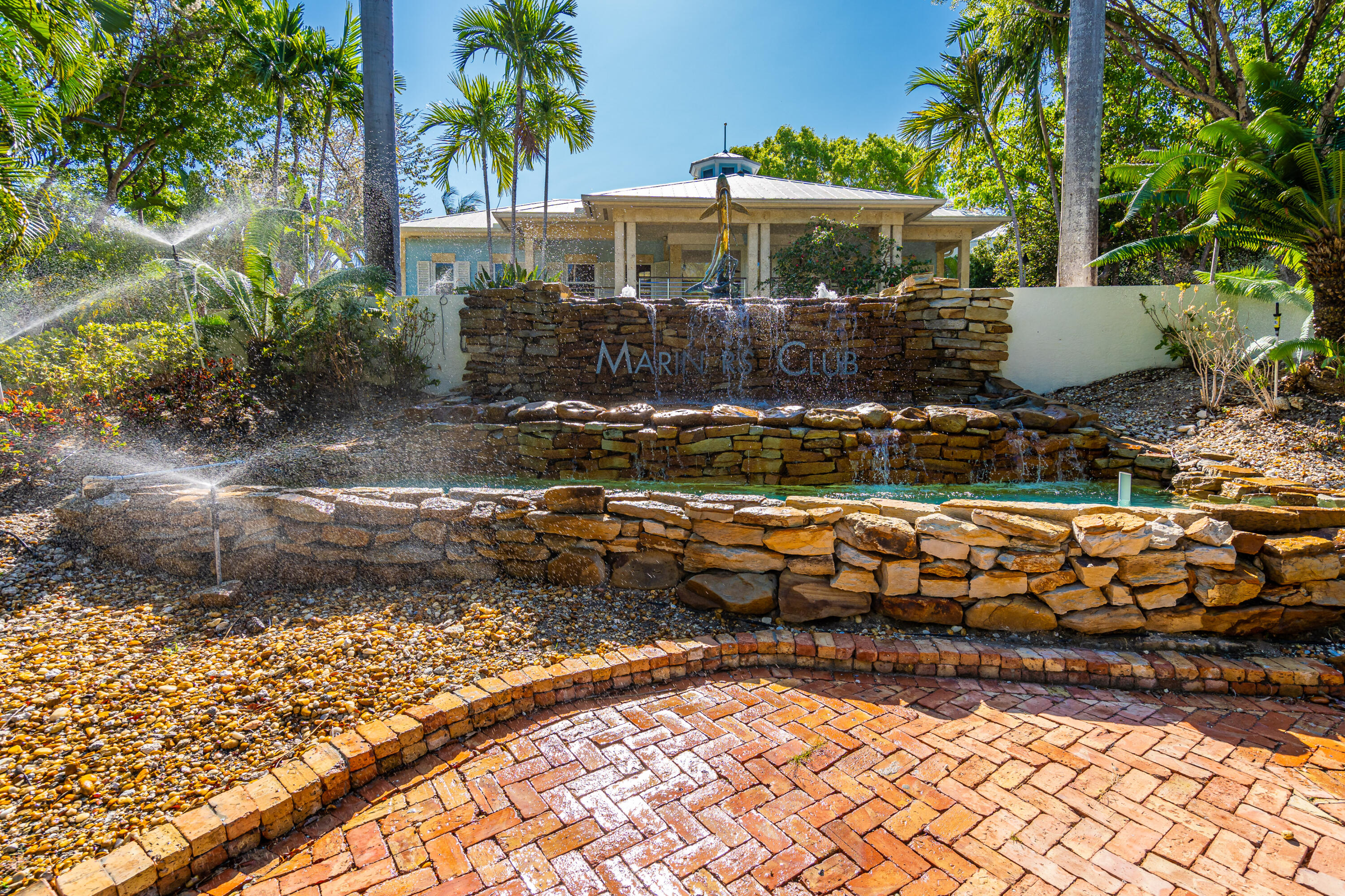 97501 Overseas Highway, Unit 607 Key Largo, FL 33037 - Photo 67 of 73 a front view of a house with a yard