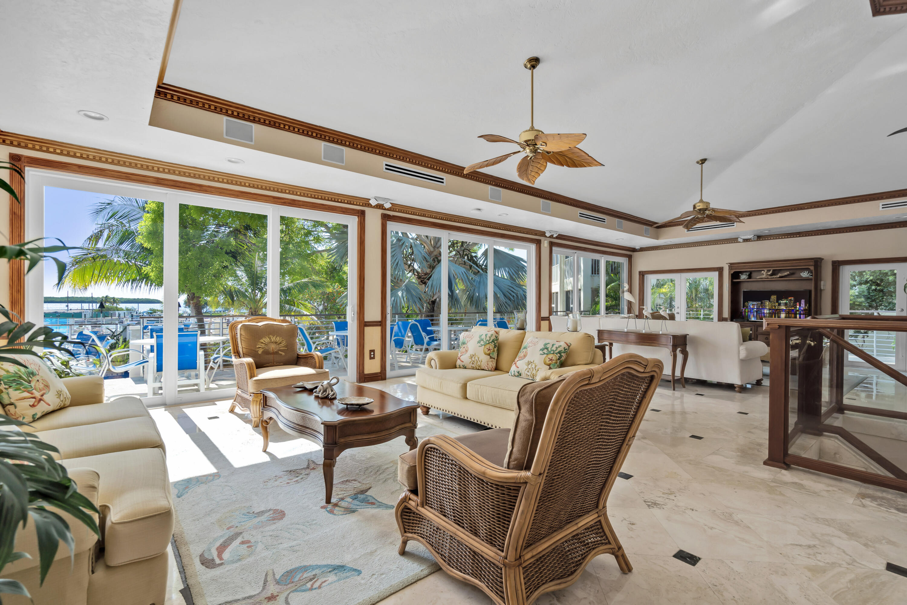 97501 Overseas Highway, Unit 607 Key Largo, FL 33037 - Photo 68 of 73 a living room with patio furniture and a floor to ceiling window