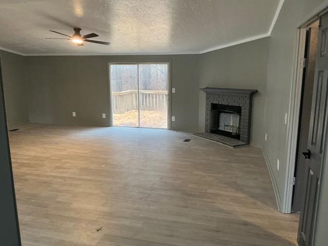 145 Walnut Bend Road Arlington, TN 38002 - Photo 4 of 9 wooden floor in an empty room with a fireplace